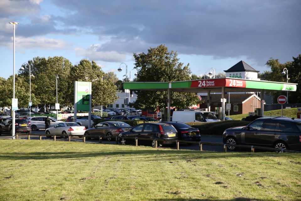 Commuters pictured queuing for fuel in London