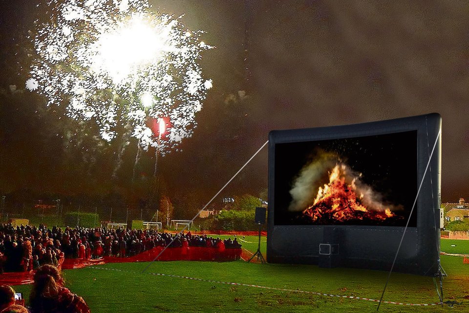 Woke firework display organisers have axed the bonfire at a Guy Fawkes bash — and replaced it with a giant telly showing a blaze