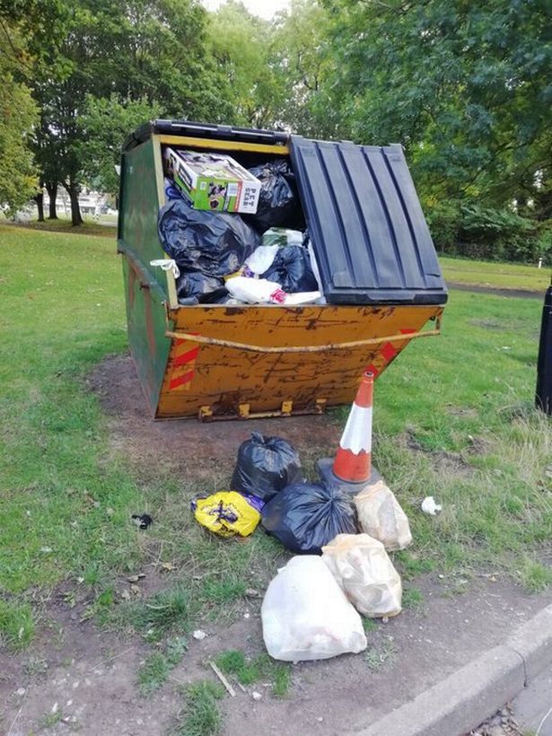 Overflowing skip installed outside Callow Place tower block