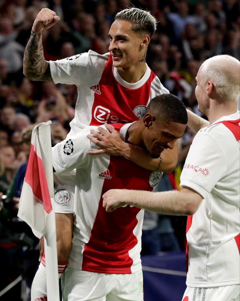 Scorers Antony Dos Santos and in-form Sebastien Haller are mobbed during Ajax's stand-out 4-0 victory over Borussia Dortmund