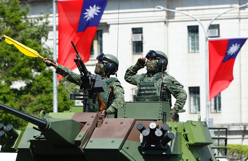 Taiwanese soldiers on a armoured vehicle during the National Day Celebration yesterday