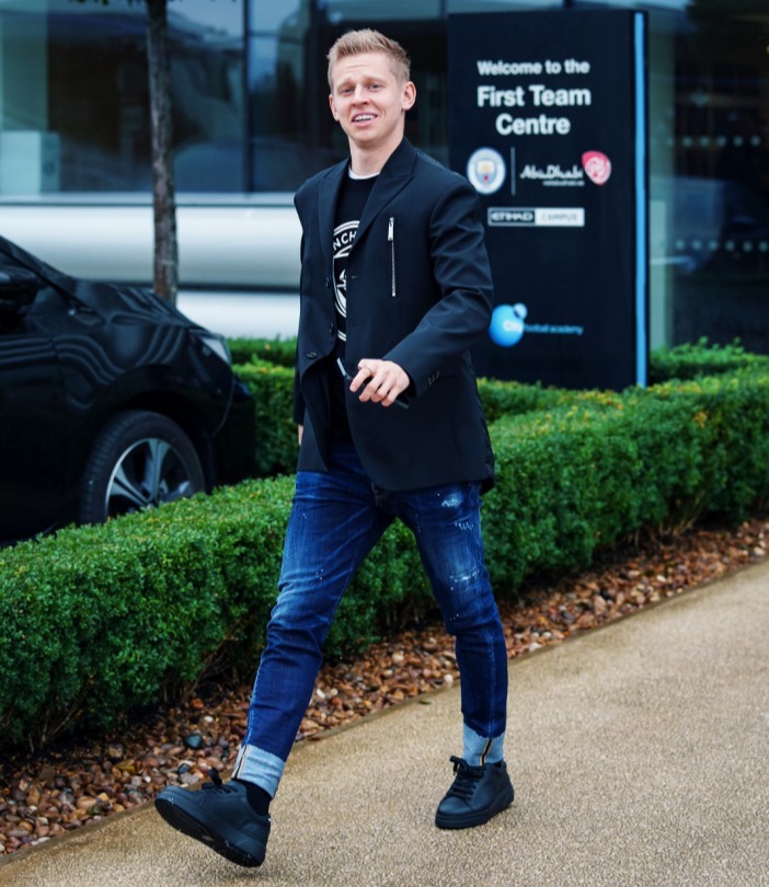 Oleksandr Zinchenko struts his stuff on the way out of the Manchester City centre