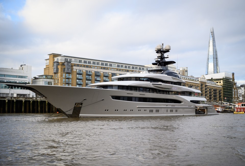 A superyacht belonging to a billionaire is moored on the River Thames, next to Tower Bridge