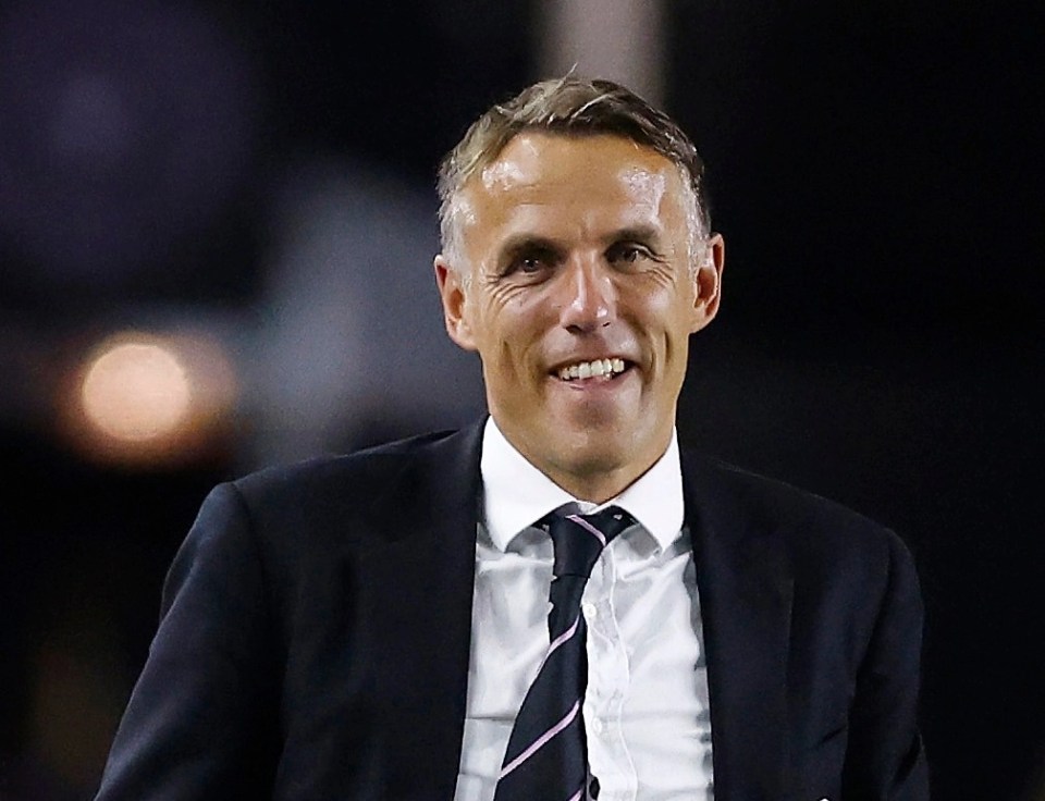 Boss Phil Neville smiles during a crucial win