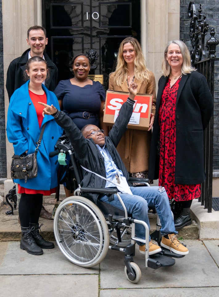 15-year-old Calvin Muteesa (front) handed the letter over to the Downing Street doorman today