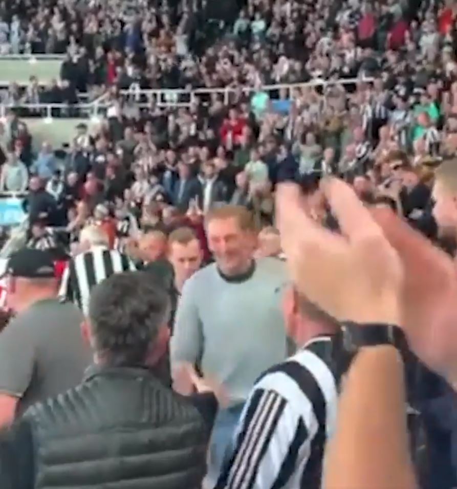 Tom Pritchard, pictured middle in the grey jumper, was given a standing ovation after his heroic intervention