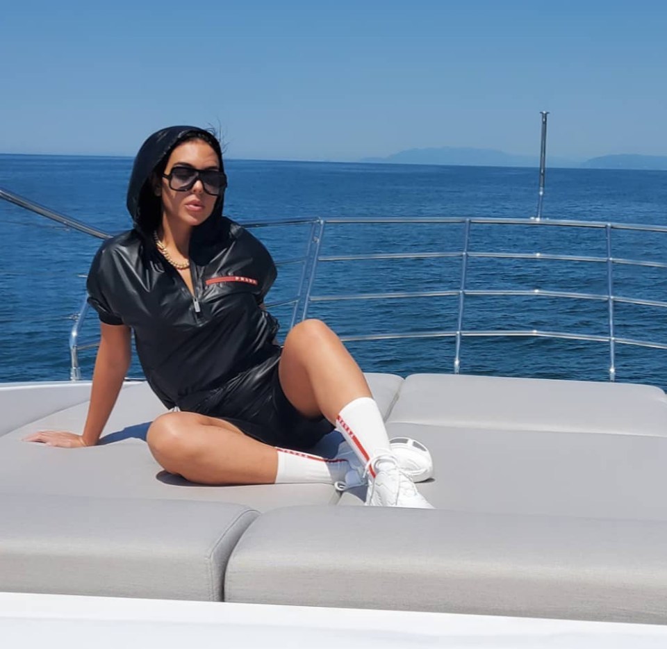 Rodriguez shows off a £2,500 Prada outfit on board their yacht