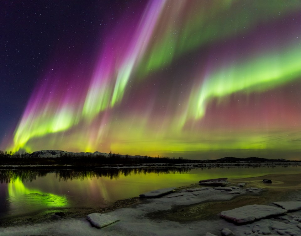 The phenomenon occurs around the Arctic Circle and creates a spectrum of colour in the skies