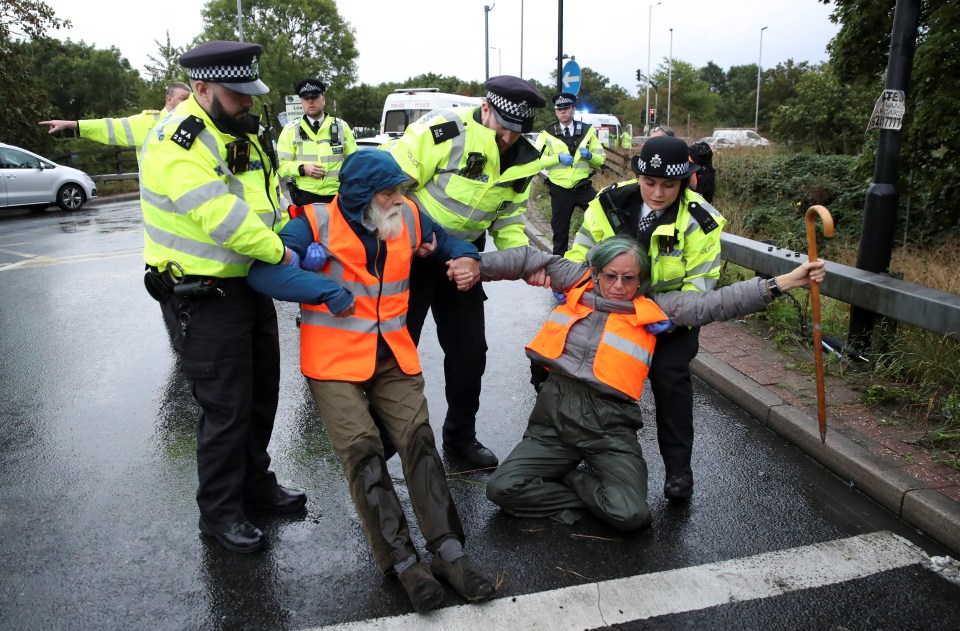 Police drag two resistant protestors away