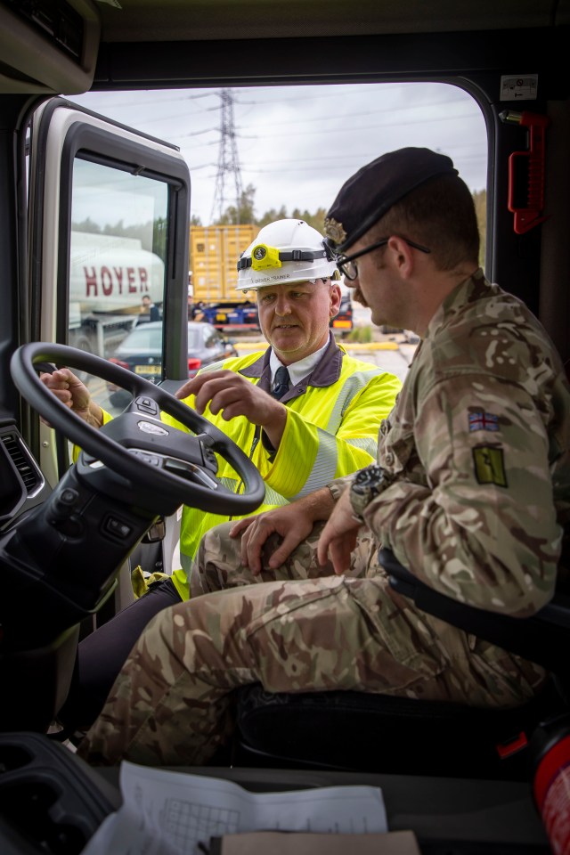 Soldiers are seen driving tankers