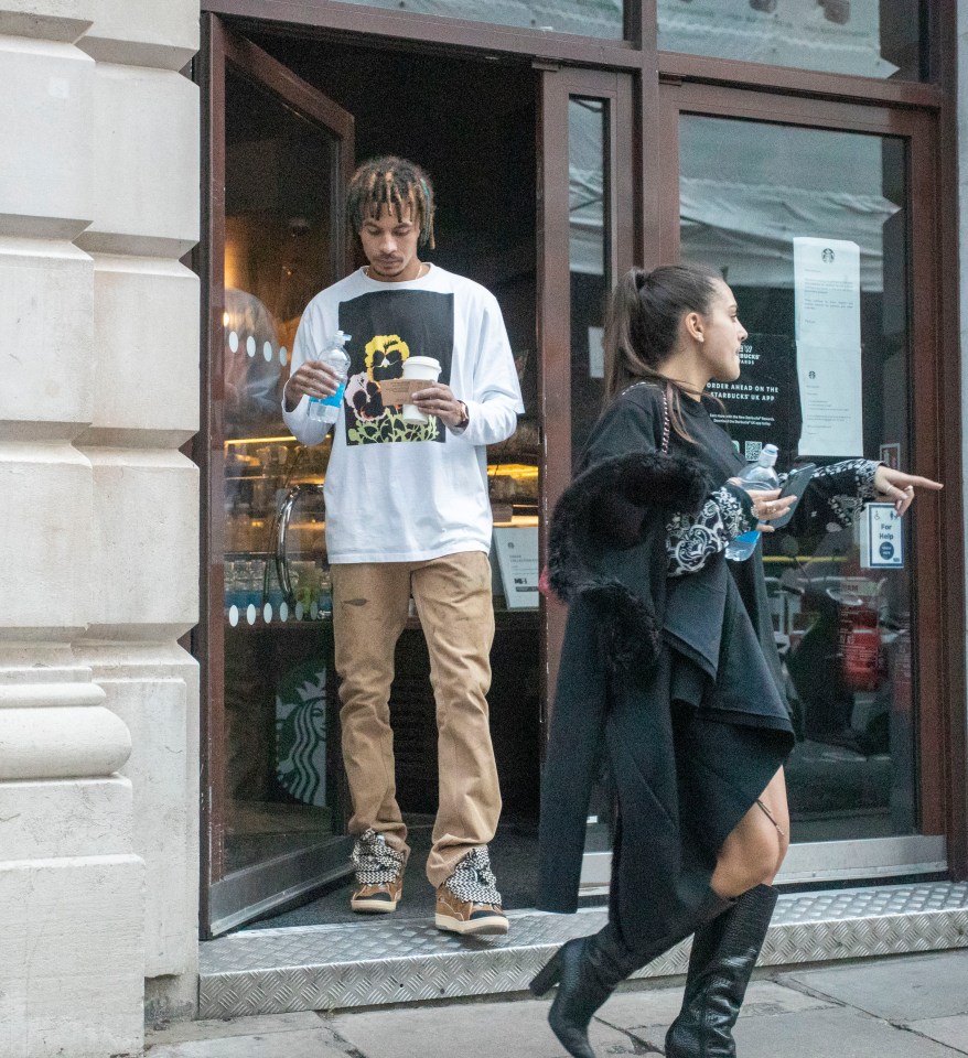 Dele and Maria, 20, clutched bottles of water as they continued their day-date following a bite to eat