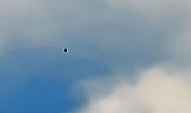 A dark object is pictured in the skies above Nevada