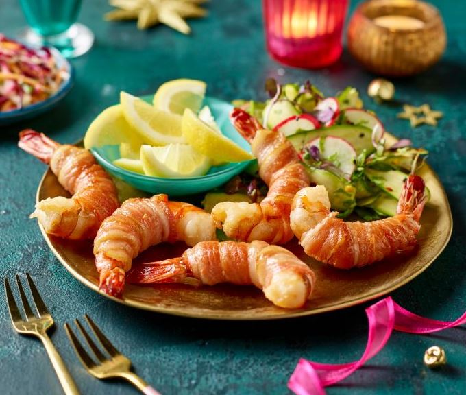 Change things up this year by serving prawns with bacon