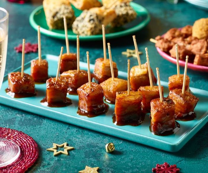 The pork belly bites are served with a BBQ sauce