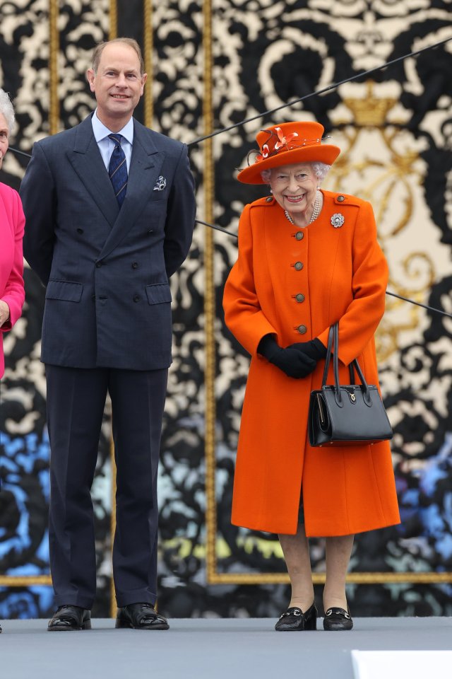 The Queen beamed as she began the Baton Relay from Buckingham Palace alongside Prince Edward