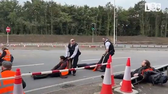 Police were seen dragging gormless activists from the junction 25 exit