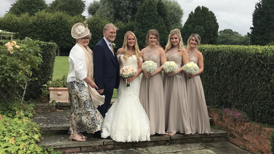 Sir David with his wife Julie at daughter Alexandra's wedding with his other girls as bridesmaids in August