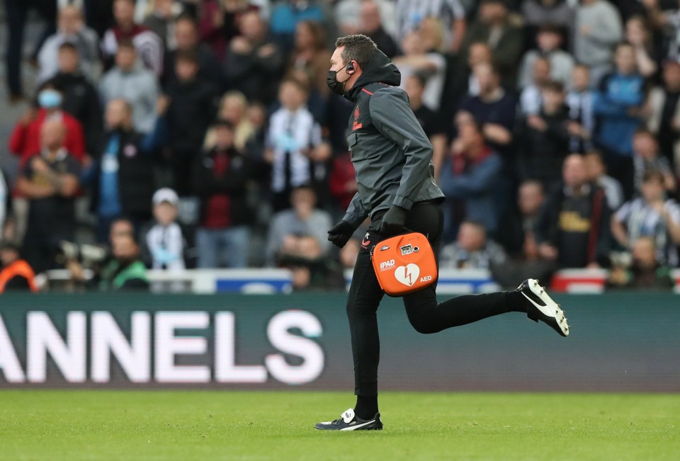 One of the medical team sprinted onto the pitch with the defibrillator