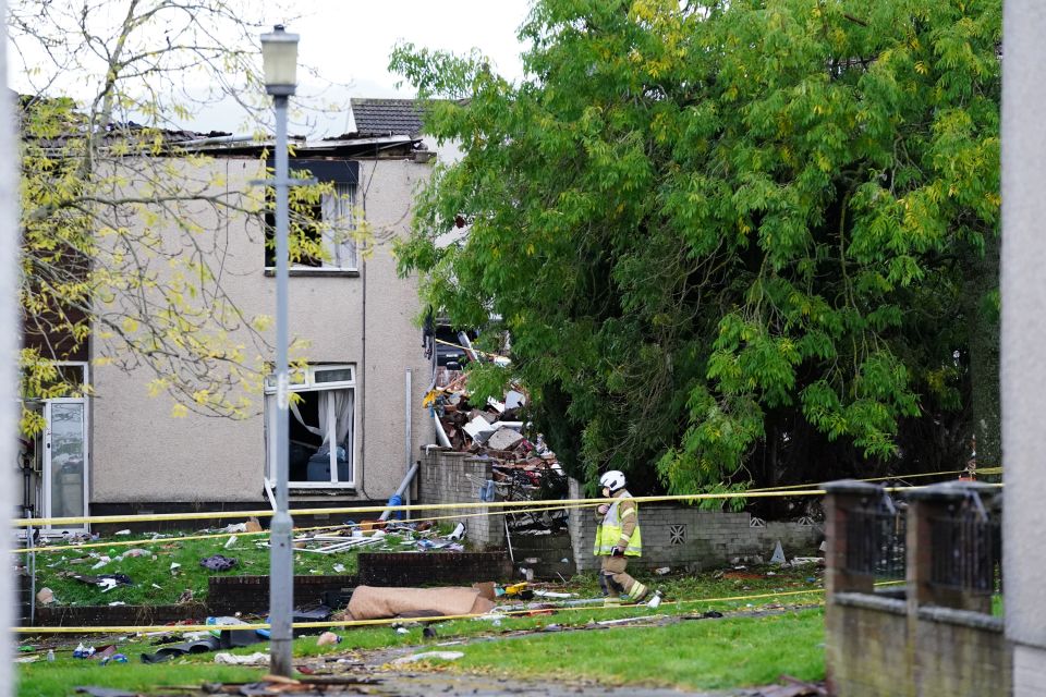 A firefighter walks past the scene in Gorse Park, Kincaidston