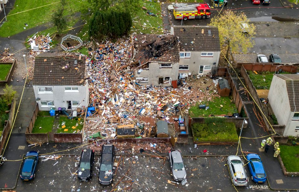 A mountain of debris can be seen where the houses once stood