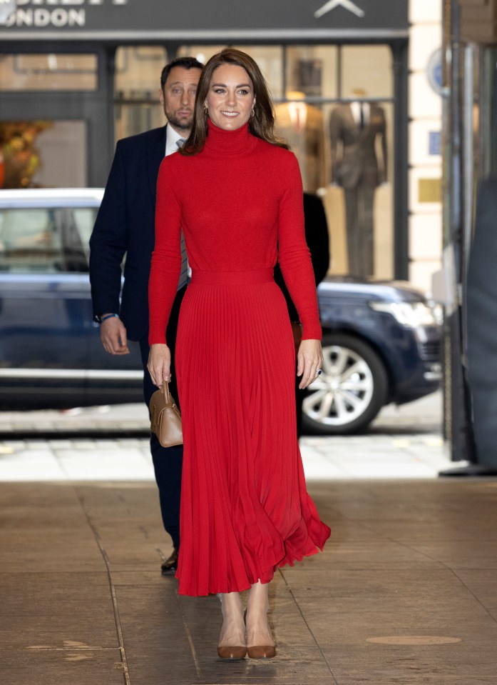 Kate flashed a smile as she arrived at the launch