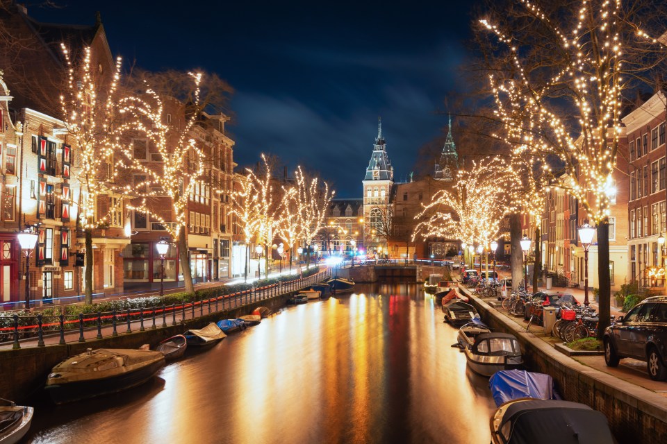 The Spiegelgracht, cargo ships, in the old town of Amsterdam