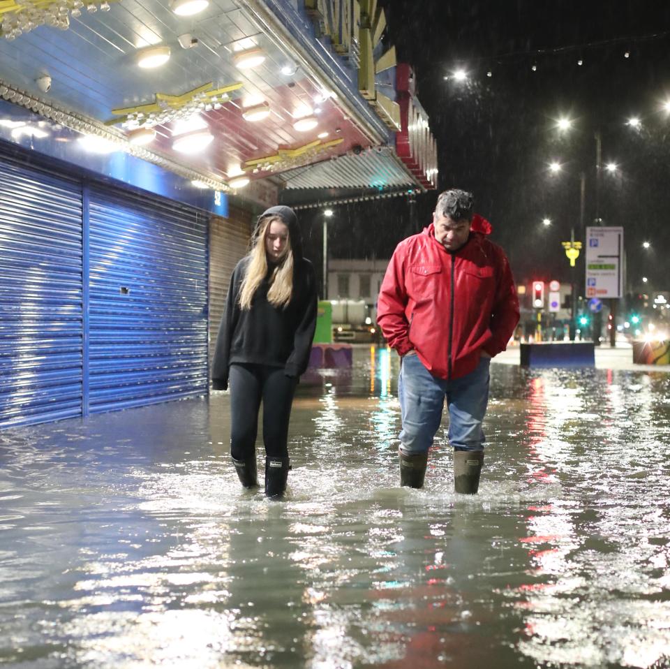 People in Essex trudge through the floodwater