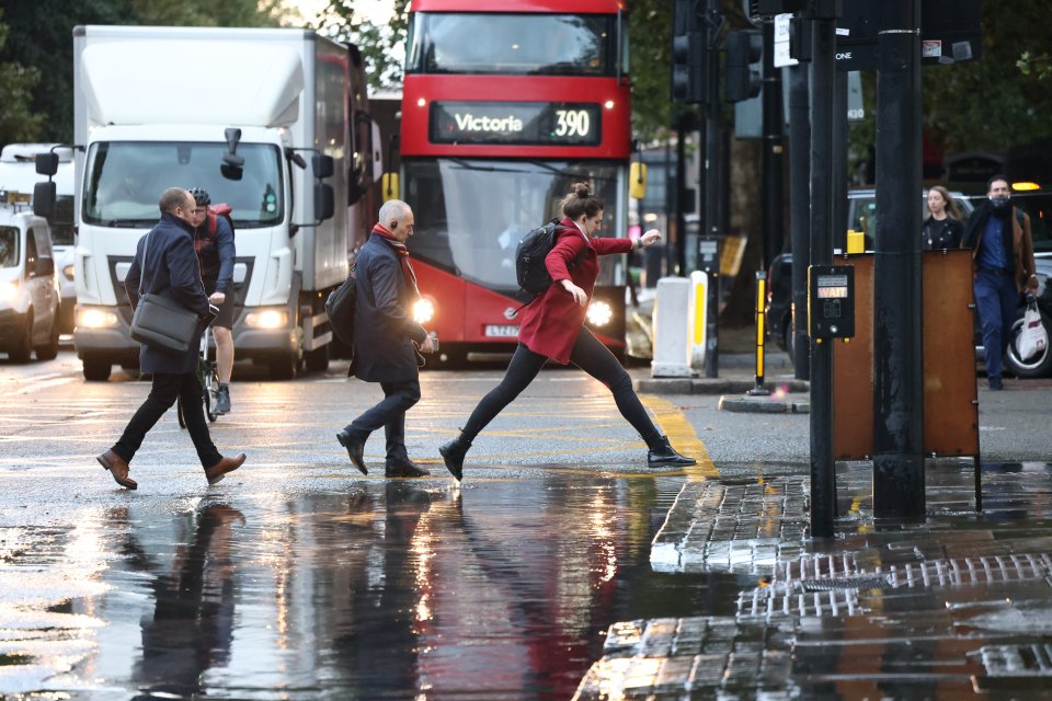 Commuters were forced to hop over puddles as they made their way to work in the soggy conditions