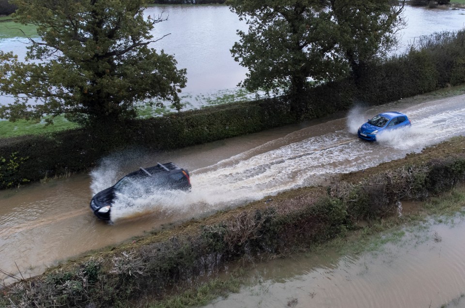 Others made their way through flood water nearby