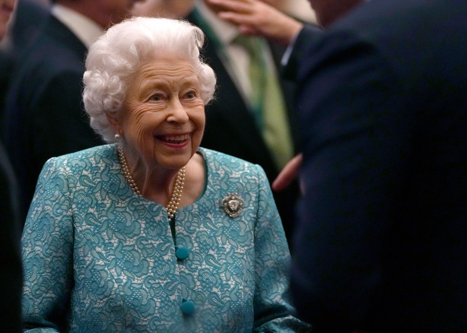 The monarch appeared in high spirits as she hosted a reception at Windsor Castle for guests attending the Global Investment Summit