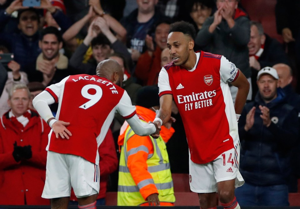 Gabon international Aubameyang reacts with Alexandre Lacazette after scoring his seventh of the season