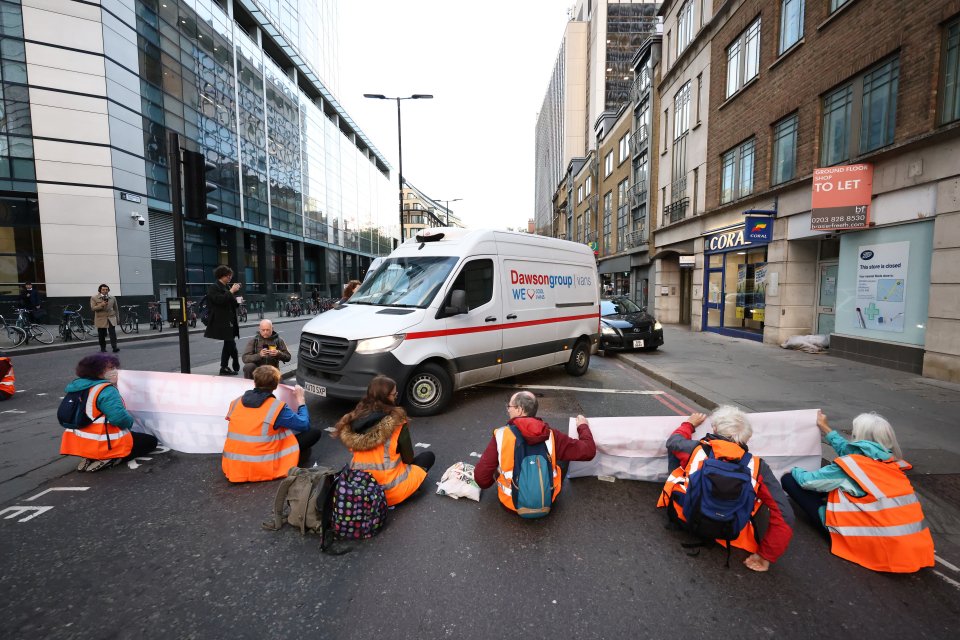 Half-term travel chaos began as Insulate Britain eco zealots block roads close to Liverpool Street Station yesterday