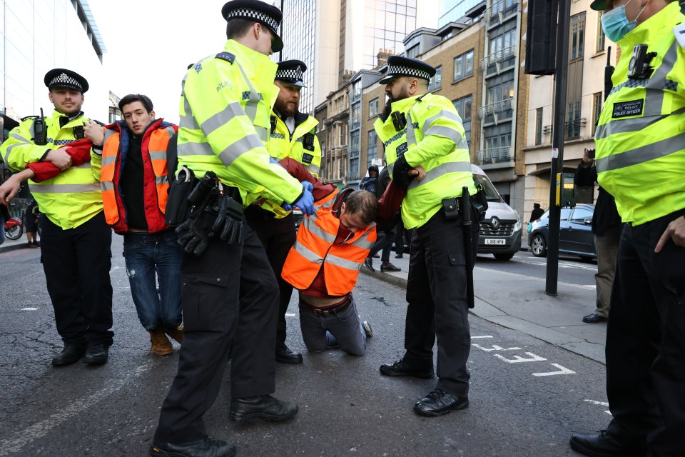 Officers were seen dragging protesters away on Bishopsgate - near to Liverpool Street