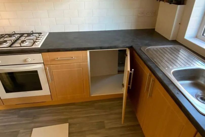 The kitchen looks as unsuspecting as most, until a closer look inside this cupboard reveals a secret room