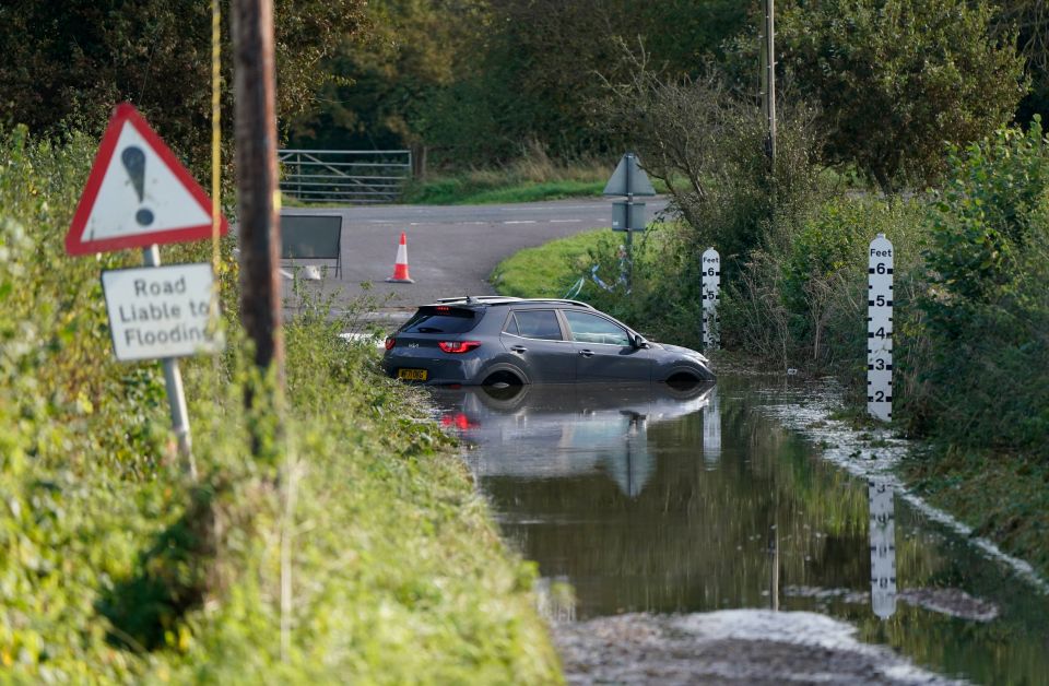 Cars have been left stranded due to the intense flooding across the UK