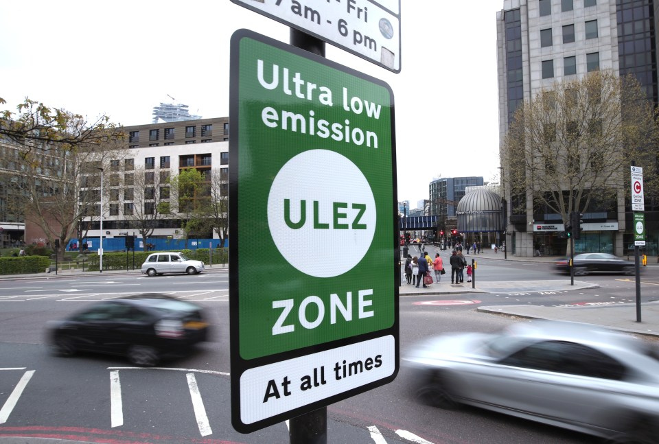 a green sign that says ultra low emission zone