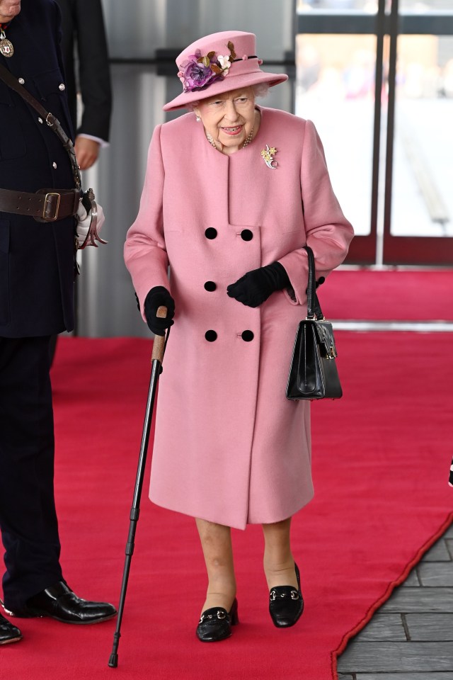 She paired her majestic pink coat with a matching floral hat