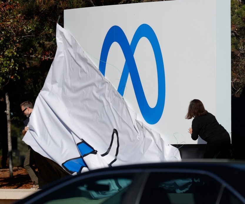 Facebook's sign shows the new Meta logo at its 1 Hacker Way HQ in Menlo Park, California