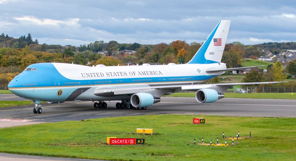 Joe Biden's security entourage is expected to generate 2.2million pounds of carbon - pictured the US President's plane touches down in Scotland