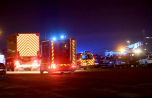 Emergency services arriving at Calais harbour in response to reports of fatalities