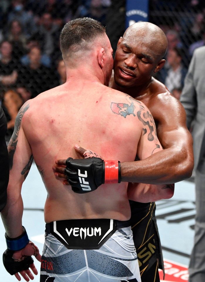 Kamaru Usman and Colby Covington embrace after their five-round war