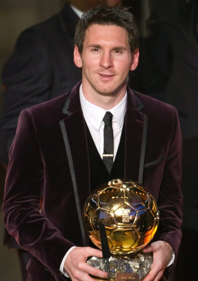 Messi donned a burgundy suit as he claimed his third straight Ballon d'Or in 2011