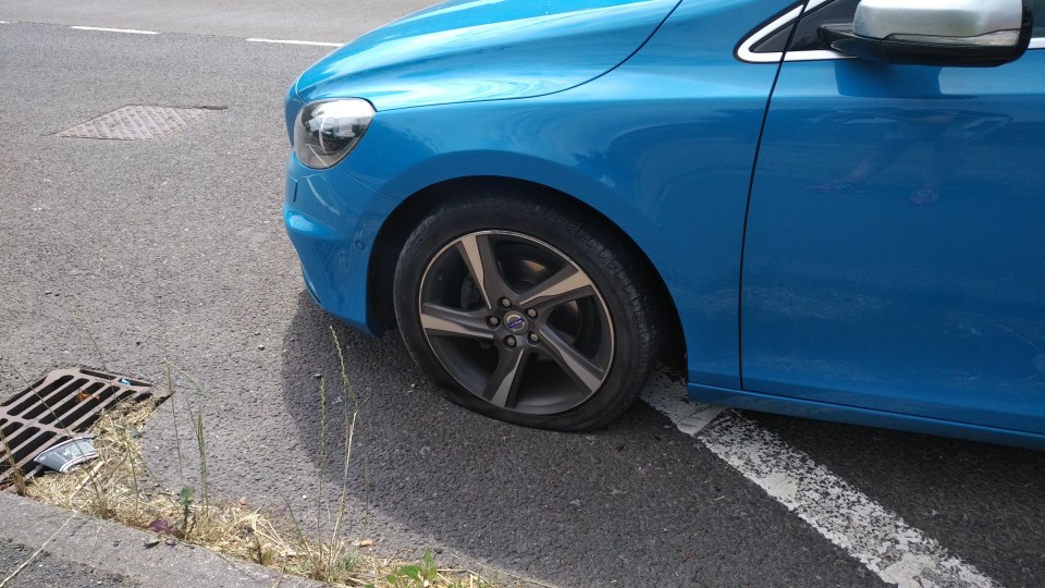 She took a photo of her blown tyre when she drove over a pot hole in her old car in 2018