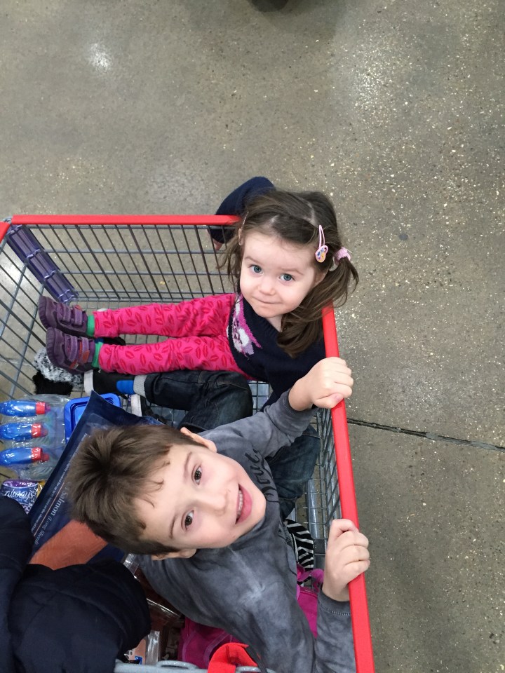 Brandon's children get a kick out of riding in the trolley at Costco