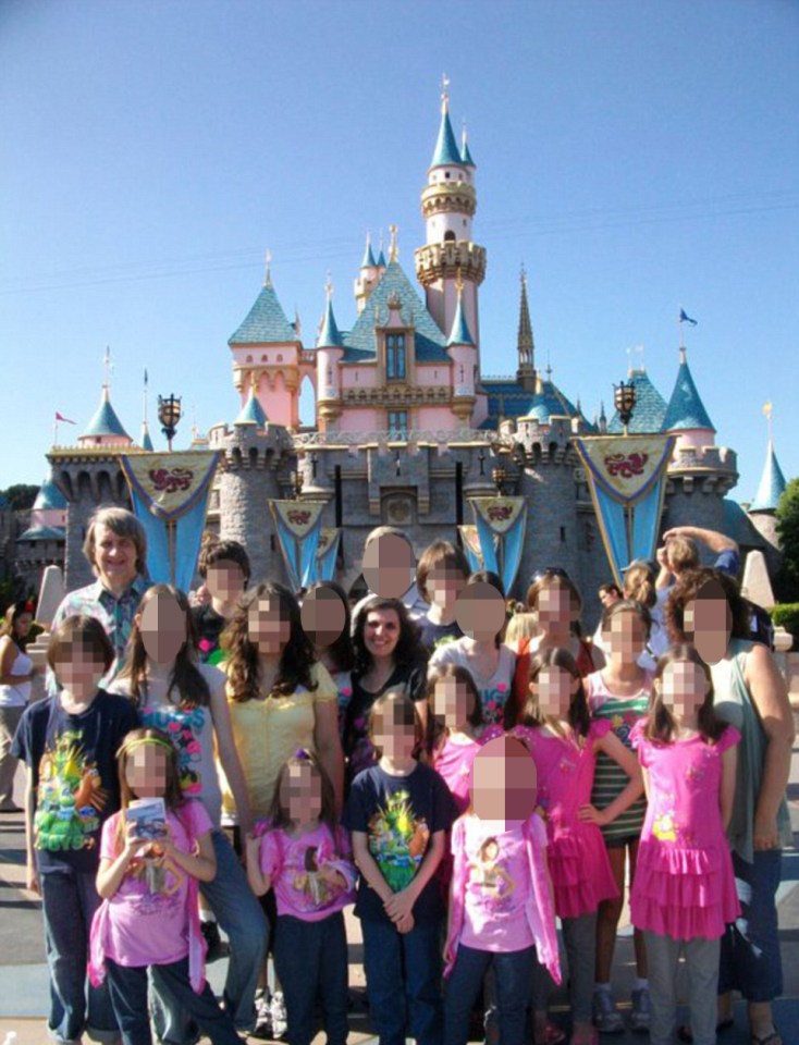 The family on a trip to Disneyland, one of the rare moments of fun