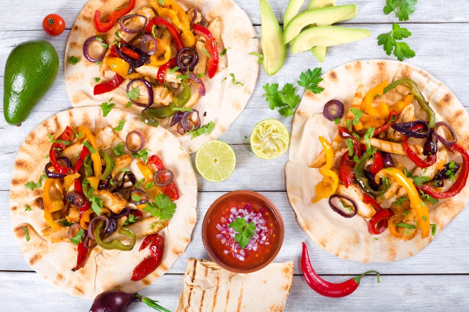 Top your chicken fajitas with guacamole, sour cream and salad