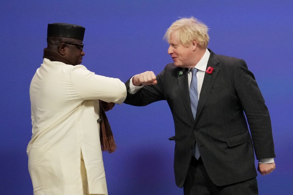 Britain's Prime Minister Boris Johnson greets Sierra Leone's President Julius Maada Bio