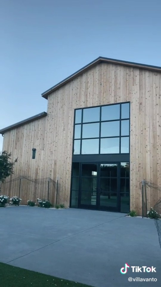 Katherine and Mario already owned the land, so started on constructing a beautiful, modern-looking barn surrounded by flowers