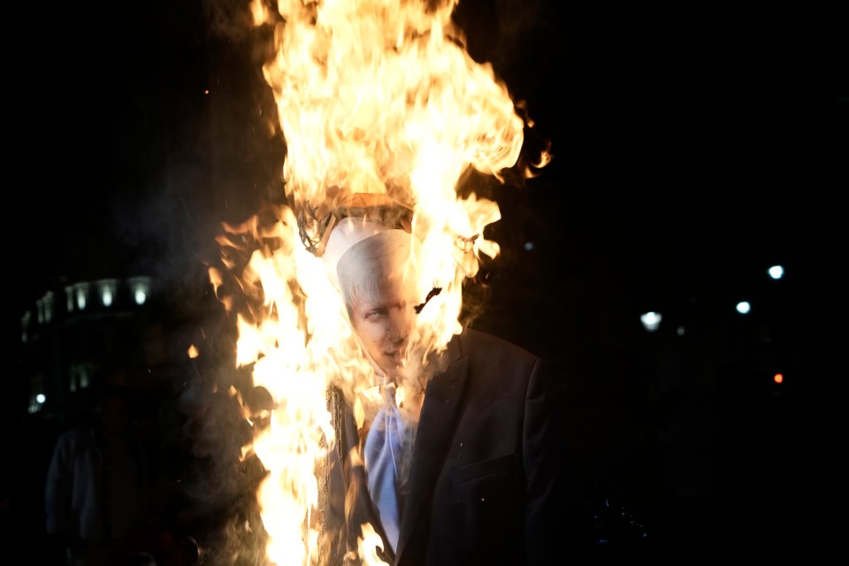 An effigy of Boris Johnson was set on fire tonight