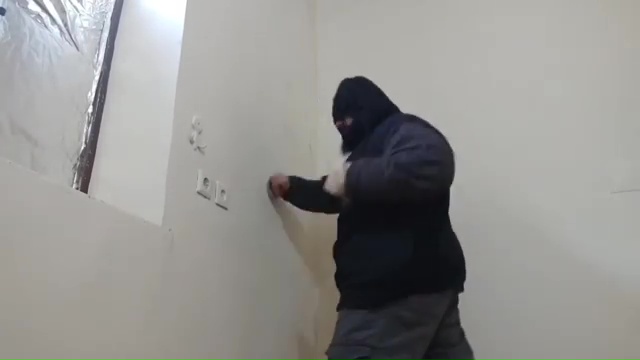 Sajad Gharibi repeatedly punches a wall